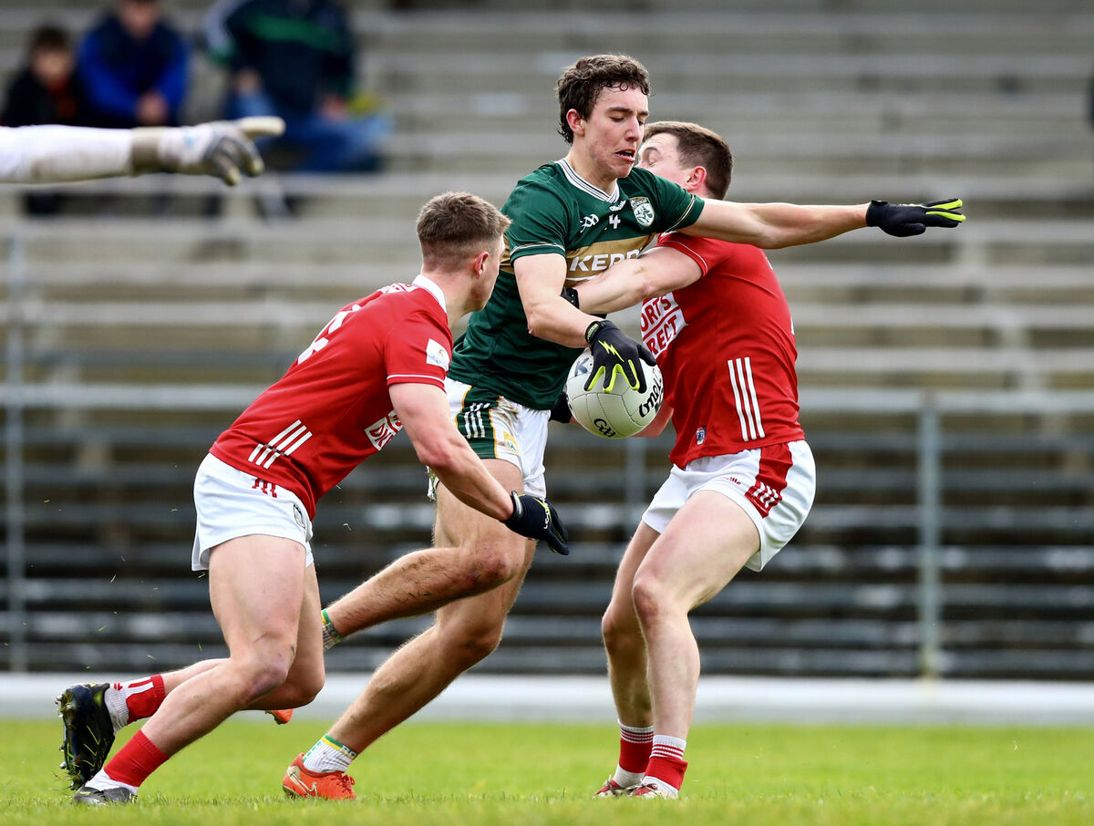 Kerry’s Tomas Kennedy in action against Cork’s Luke Fahy and Jacob O’Driscoll. Picture: INPHO
