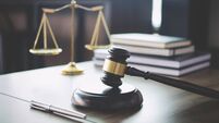 Scales of justice and Gavel on wooden table and Lawyer or Judge working with agreement in Courtroom, Justice and Law concept