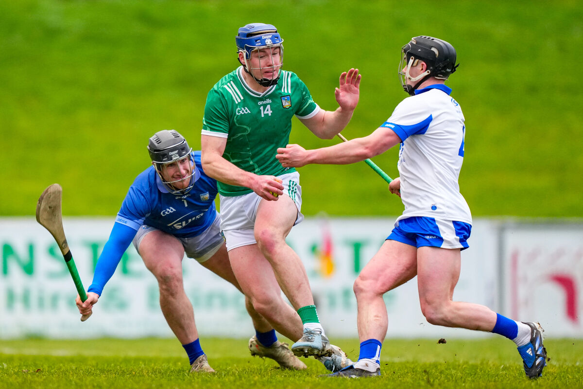 Shane O'Brien of Limerick is tackled by Jack Lacey of Waterford and Billy Nolan of Waterford during their Munster Senior Hurling League final this year. Picture: ©Inpho/James Lawlor