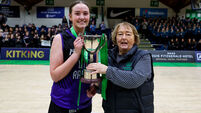 Lucy Walsh is presented with the trophy 21/1/2025