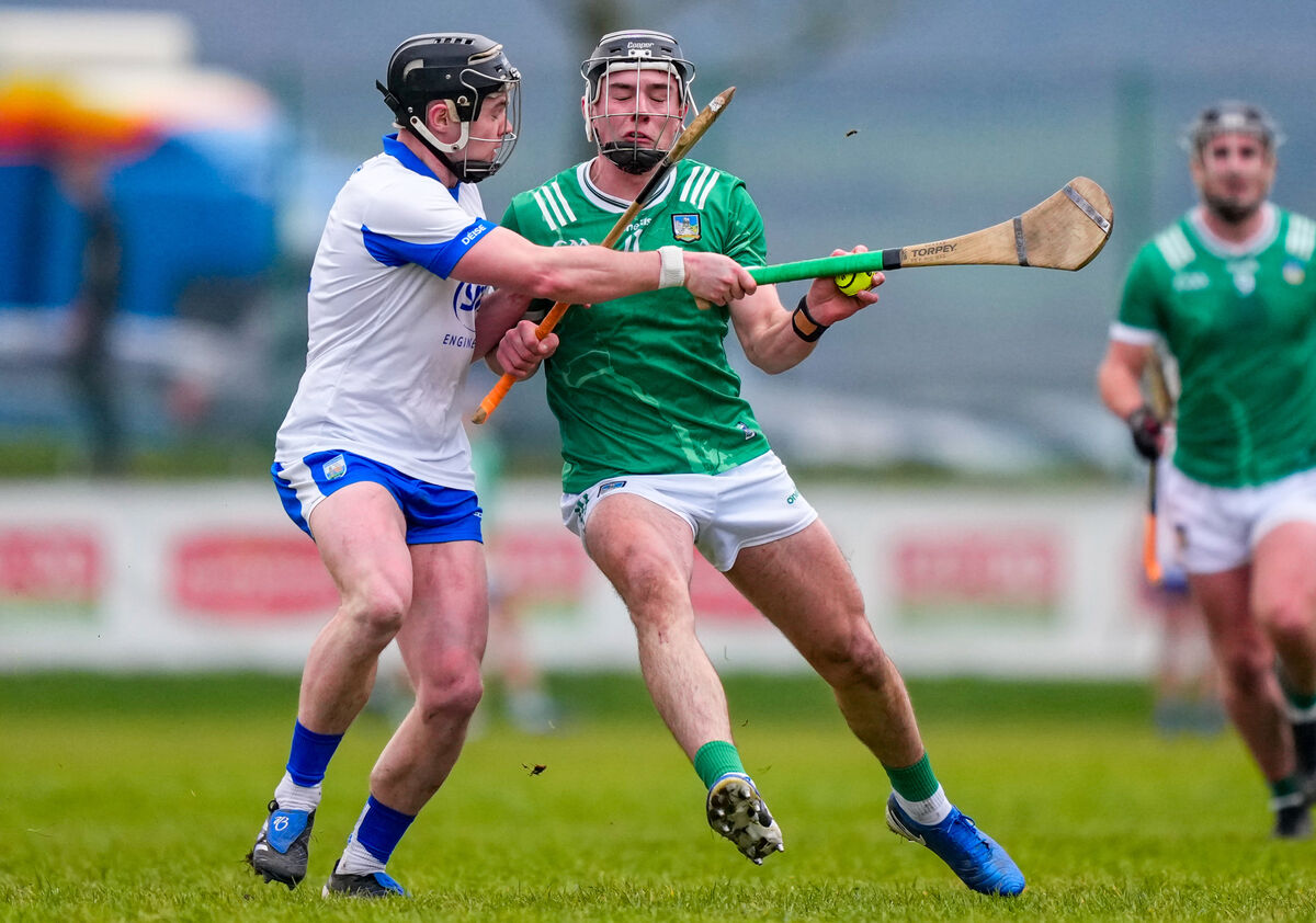 Aidan O'Connor of Limerick takes on Jack Lacey of Waterford. Picture: INPHO/James Lawlor