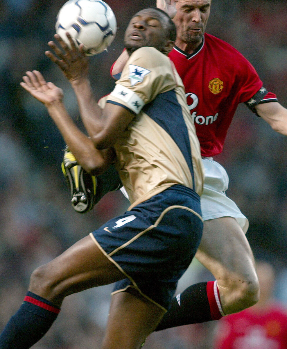 Manchester United's Roy Keane challenges Patrick Viera of Arsenal for the ball, during their FA Barclaycard Premiership match at Old Trafford, Wednesday 8th May 2002. PA Photo : Phil Noble