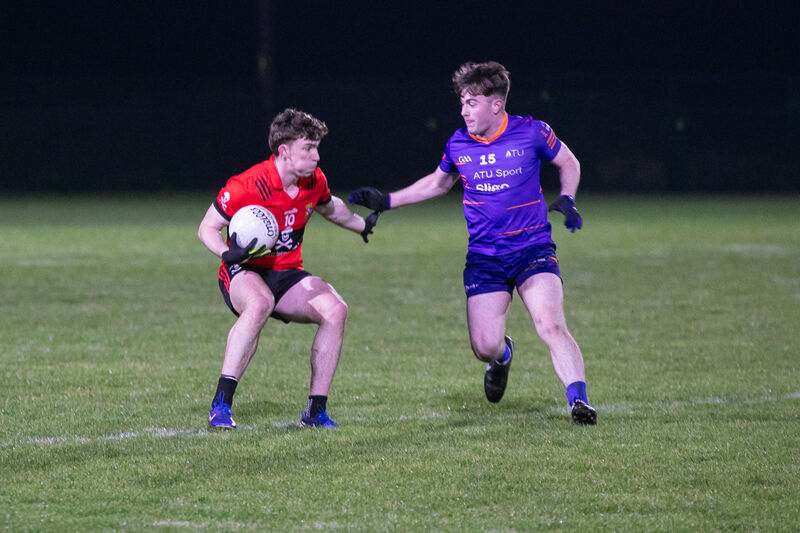 UCC's Ruairí Murphy takes on ATU Sligo's Dylan Walsh. Picture: Gareth Chaney