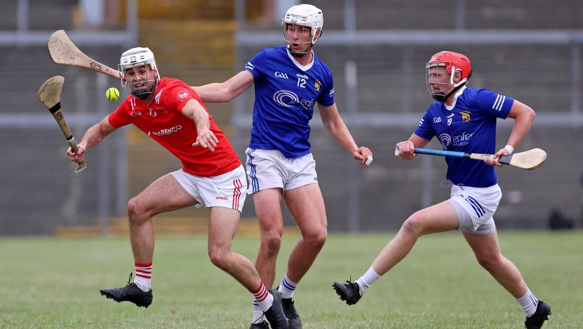 Evan Cullinane and Charlie Grainger, Ballinhassig, battle to dispossess Mike O'Dwyer, Castlemartyr. Picture: Jim Coughlan.