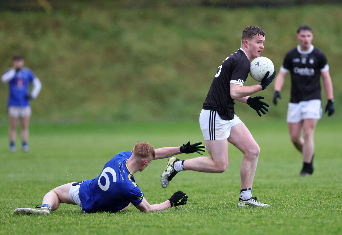  Dara O'Sullivan, St. Francis College, gets away from Eoin O'Flaherty, Tralee CBS.