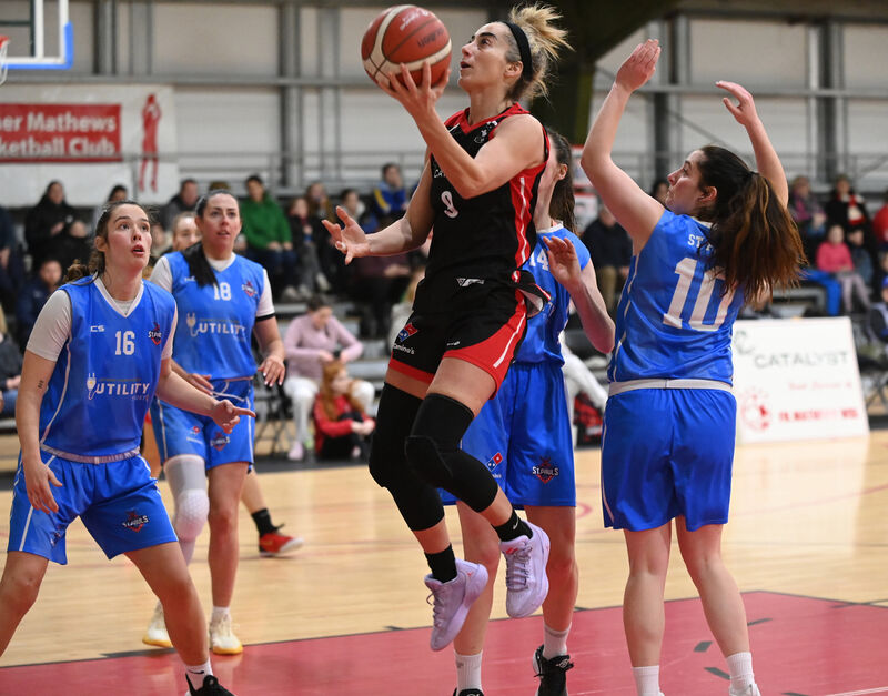 Catalyst Fr Mathew's Grainne Dwyer lays up a basket from Utility Trust St Paul's Denise Dunlea, Lorraine Scanlon and Lovisa Hevinder. Picture: Eddie O'Hare