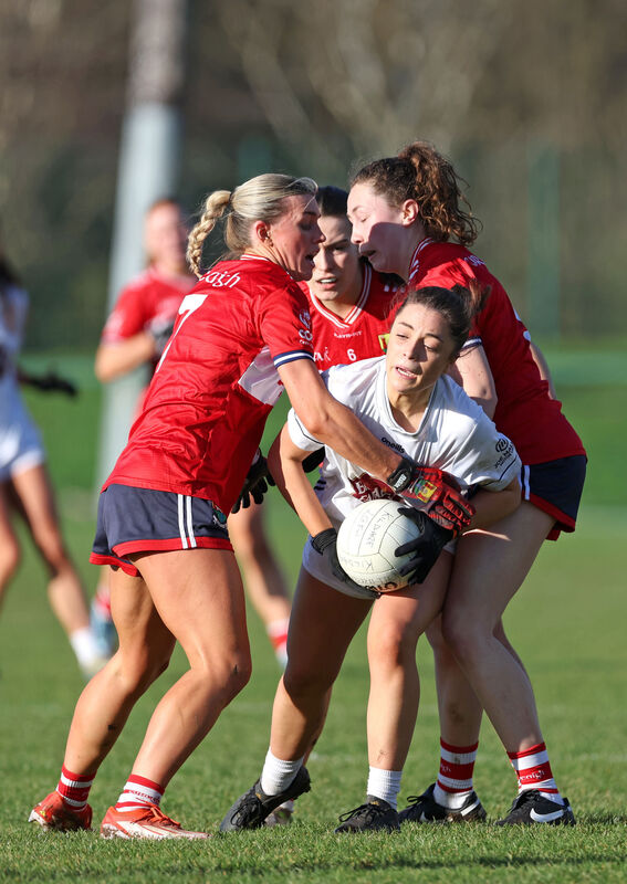 Rosie Corkery, Sadbh McGoldrick and Abbie O'Mahony, Cork, tackle Mayah Doyle, Kildare. Picture: Jim Coughlan. Rosie Corkery, Sadbh McGoldrick and Abbie O'Mahony, Cork, tackle Mayah Doyle, Kildare. Picture: Jim Coughlan.