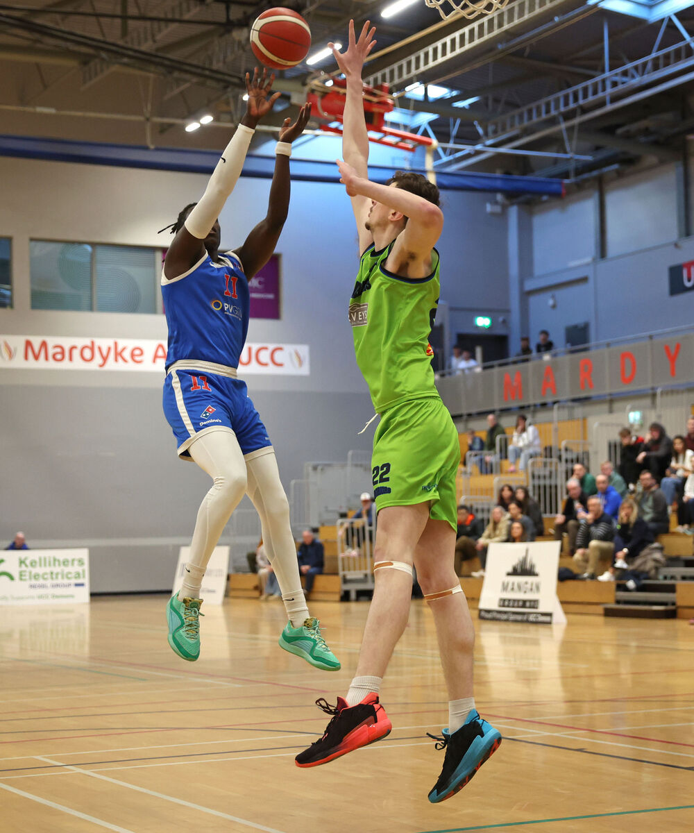 Tala Fam Thiam, UCC Demons, shoots from Cian Sullivan, Tralee. Picture: Jim Coughlan.