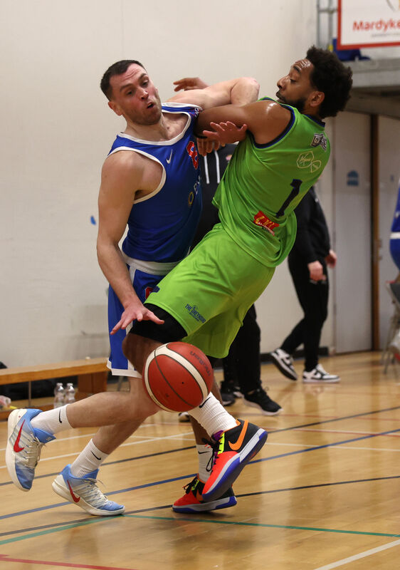  Kyle Hosford, UCC Demons, battling Jordan Perkins, Tralee. Picture: Jim Coughlan.