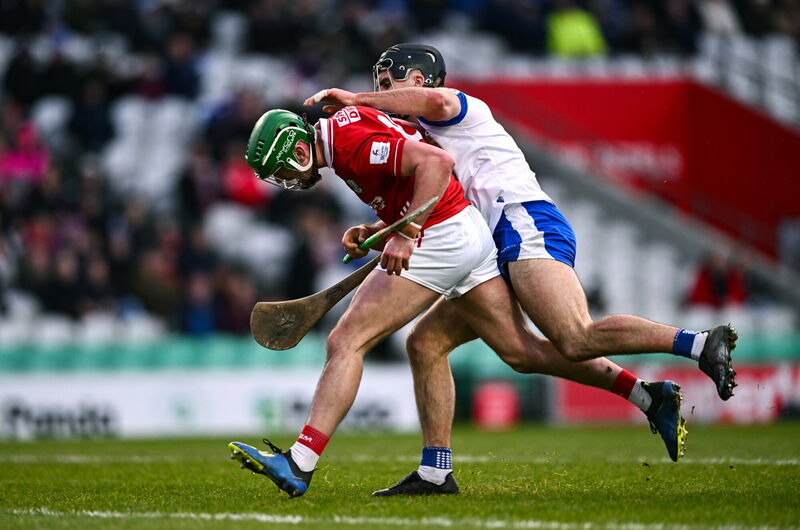 Brian Roche of Cork is fouled by Mark Fitzgerald of Waterford, resulting in a penalty. Picture: Ben McShane/Sportsfile