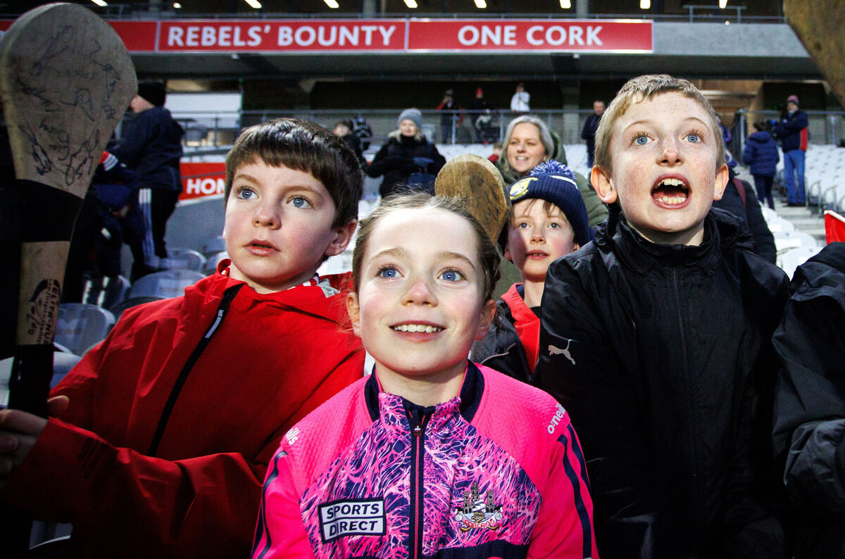 Young Cork supporters wait for autographs after the game. Picture: Inpho/Tom Maher
