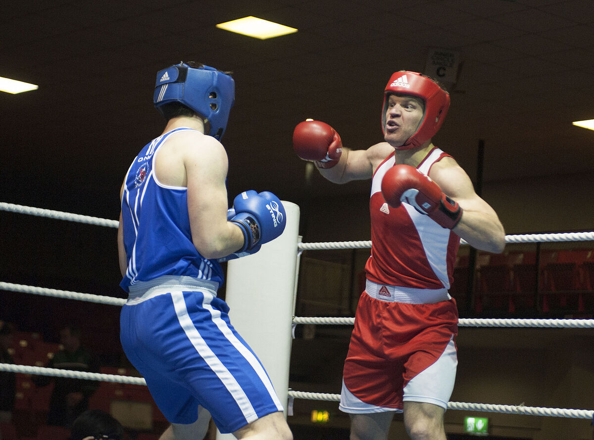 UCC's Niall McCarthy delivers a punch. Picture: Dave Meehan.