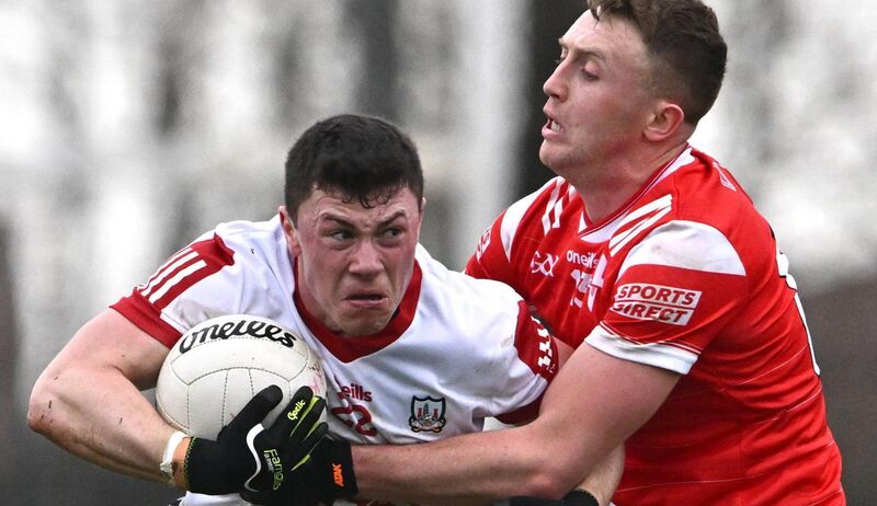 Mark Cronin of Cork is tackled by Ryan Burns of Louth in 2024. Picture: Ben McShane/Sportsfile