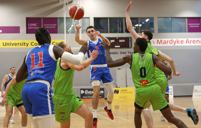  James Hannigan, UCC Demons, gets his pass away against Tralee. Picture: Jim Coughlan.