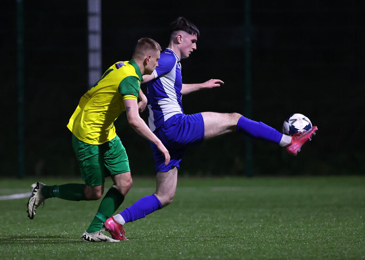  Oscar Ahern, College Corinthians, battles Arseni Lamonov, Rockmount, in the Grandons Toyota Munster Senior Cup clash at Castletreasure. Picture: Jim Coughlan.