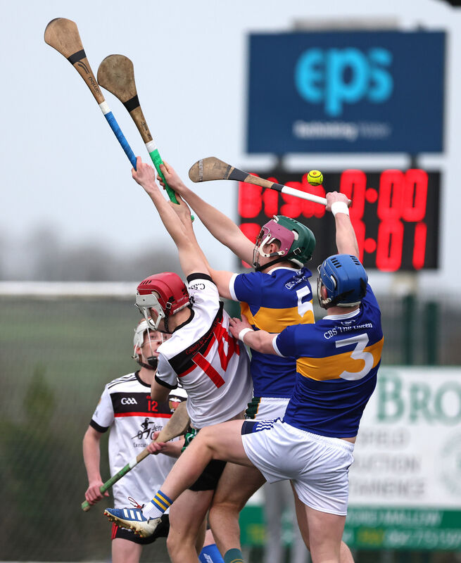  James Naughton, Coláiste An Spioráid Naomh Bishopstown, rises high with Matthew O'Sullivan and John O'Donovan, Tralee CBS. Picture: Jim Coughlan.