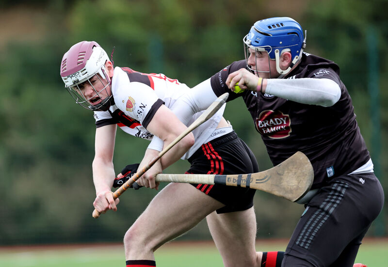  Neil Crowley, Coláiste An Spioráid Naomh Bishopstown, battling Cian Harris, Tralee CBS goalkeeper. Picture: Jim Coughlan.