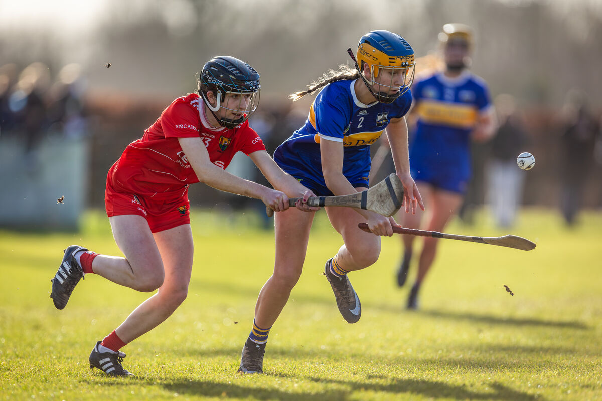 Tipperary’s Eimear Ryan and Cork’s Lea Meillouin chase after the sliotar.