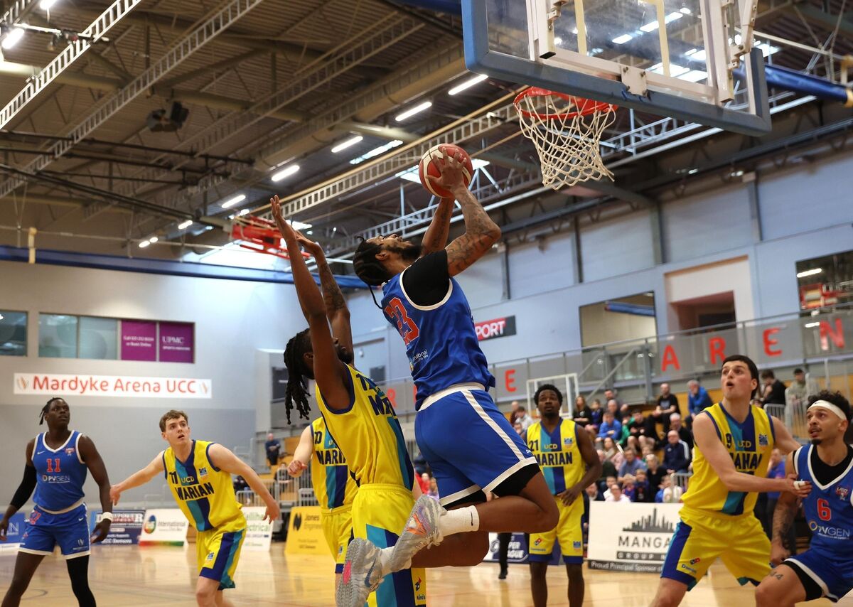  Jordan Washington rises to score for UCC Demons. Picture: Jim Coughlan.