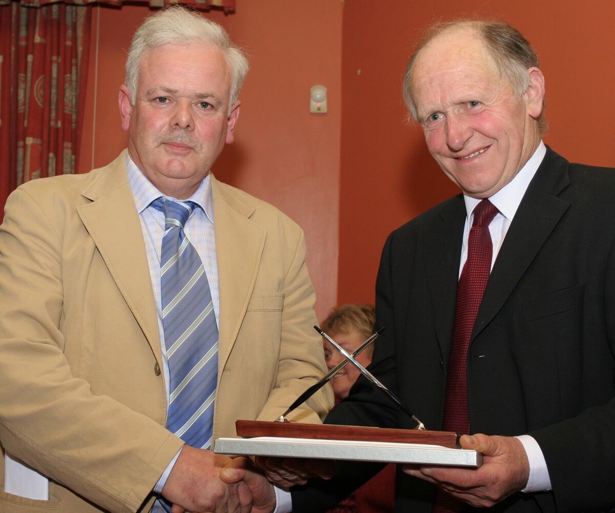 Michael Keane, president of Cloughduv Hurling Club, making a presentation to author Michael Galvin at the launch of 'Hand Me Down My Hurley', a history of the club, in 2006. Picture: Kieran Boyde