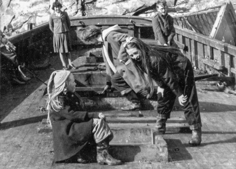 Jo Kerrigan with her family on a ship-wrecked boat - her father was fascinated by them and would explore them with his children. BELOW: An image following a fire on Patrick Street in May, 1917