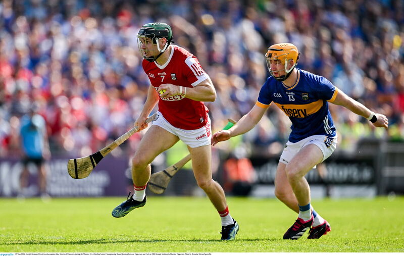 Mark Coleman of Cork takes on Jake Morris of Tipperary. Picture: Brendan Moran/Sportsfile