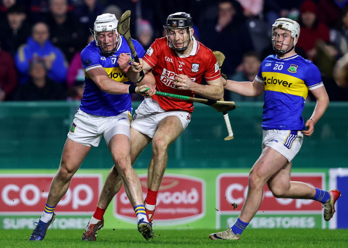 Tipperary's Eoghan Connolly collides with Eoin Downey of Cork. Picture: INPHO/Ben Brady