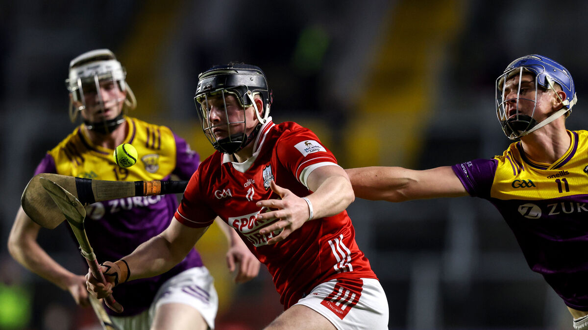 Cork's Finn O'Brien is tackled by Colin Carley of Wexford. Picture: ©Inpho/Ben Brady