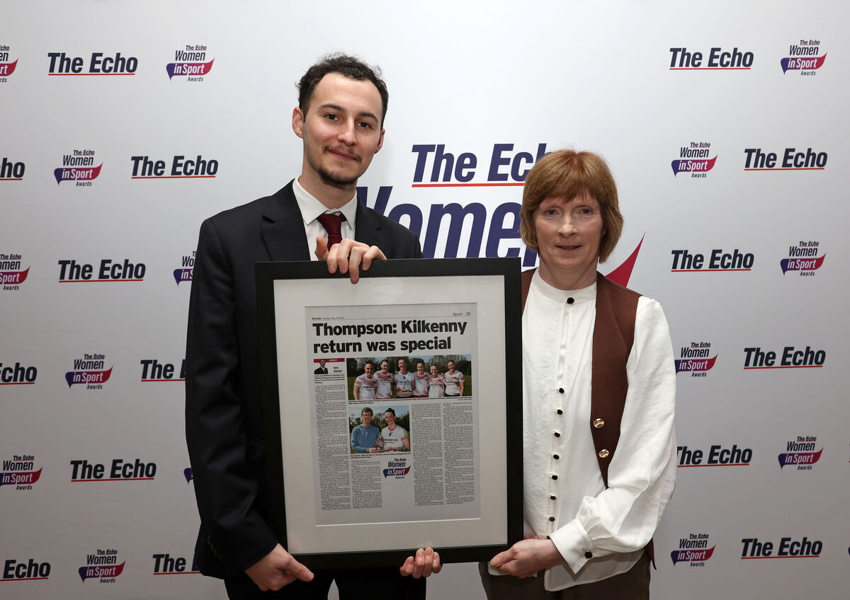Jack McKay presents Ashling Thompson's monthly award to her mother Sheila at The Echo Women In Sport Awards at The Metropole Hotel. Picture: Jim Coughlan.