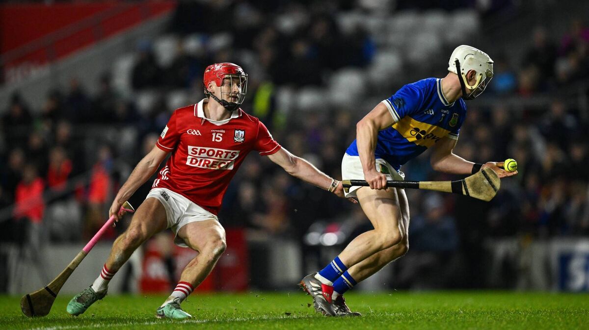 Bryan O'Meara of Tipperary is tackled by Alan Connolly of Cork. Picture: Ray McManus/Sportsfile
