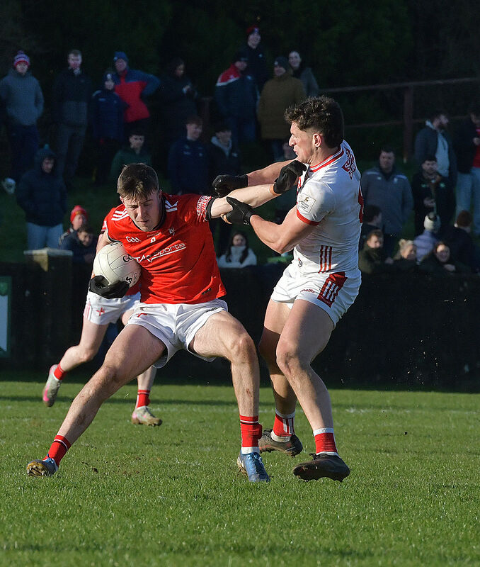  Cork's Colm O'Callaghan and Louth's Dara McDonnell fight for possession during their Allianz Football League tie in Drogheda. Photograph: Moya Nolan