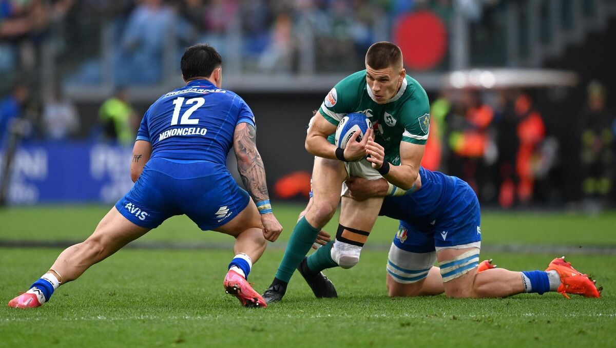 Sam Prendergast of Ireland is tackled by Tommaso Menoncello and Manuel Zuliani of Italy last season. Picture: Ramsey Cardy/Sportsfile