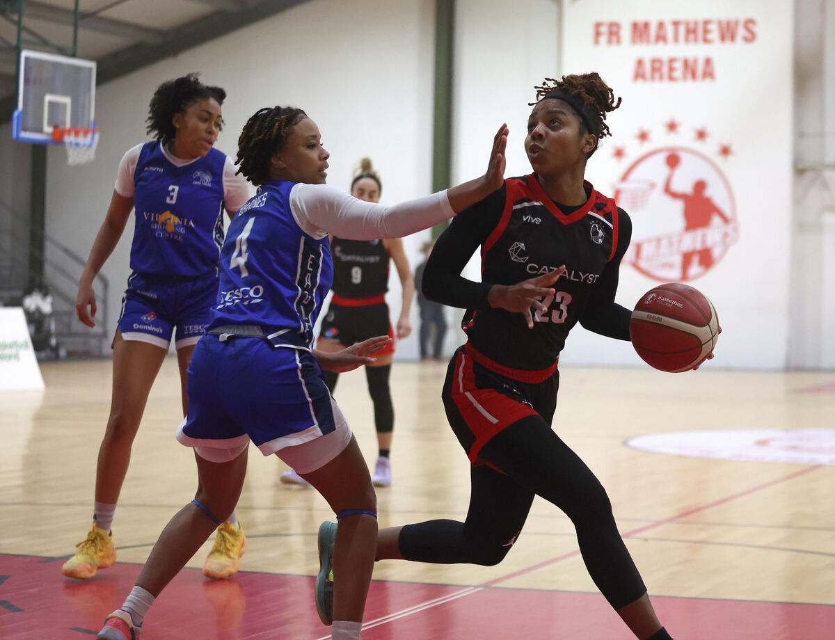  Stacie Jones, Fr Mathew's, looks for a way past Soleil Barnes, Cavan Eagles. Picture: Jim Coughlan.