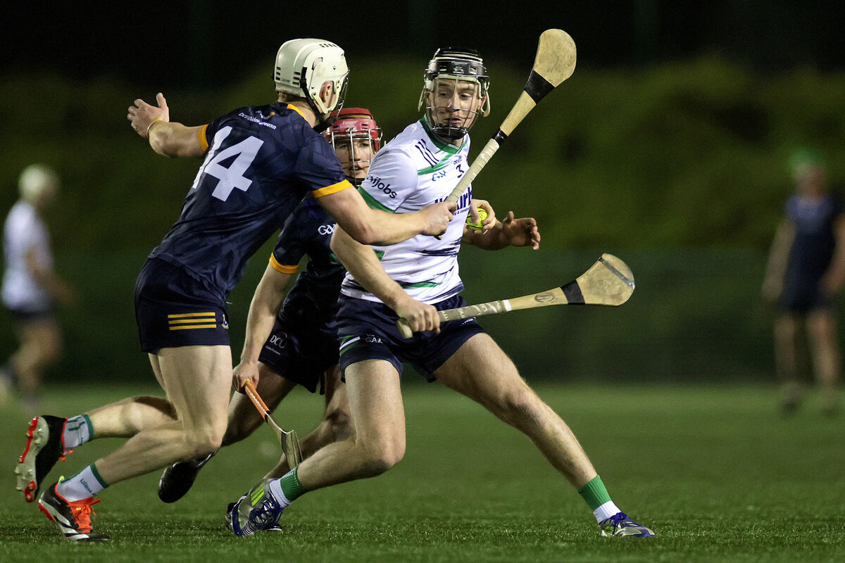 University of Limerick's Oisín Fitzgerald - who plays his club hurling for St Catherine's - looks to evade Sam Byrne of DCU Dóchas Éireann. Picture: Inpho/Laszlo Geczo