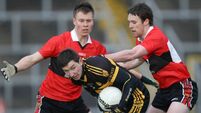 Daithi Casey under pressure from Niall Daly and Sean Kiely 4/12/2011