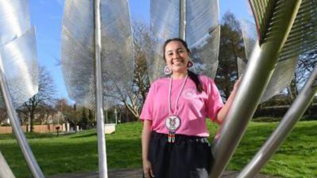 <p class="contextmenu internal_Caption">Skylee Glass, of the Chcotaw Nation, who graduated from UCC in 2024, at the Choctaw monument in Midleton, Co. Cork</p>