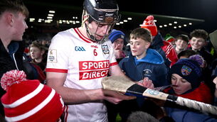 <p>Robert Downey of Cork signs autographs after the Galway game. Picture: Ben McShane/Sportsfile</p>