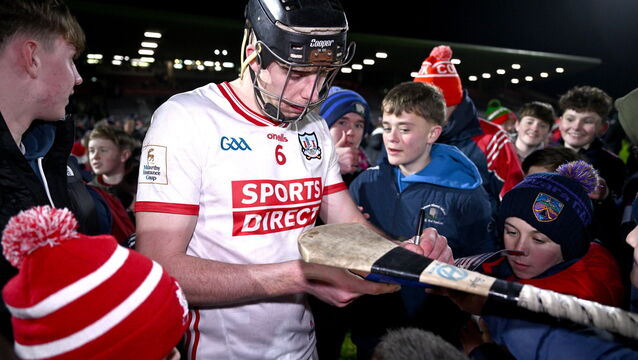 <p>Robert Downey of Cork signs autographs after the Galway game. Picture: Ben McShane/Sportsfile</p>