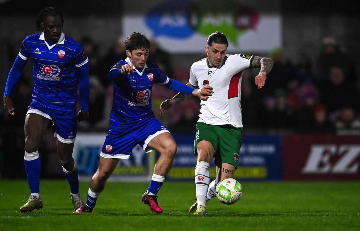Ruairi Keating of Cork City in action against Steven Healy of Treaty United. Picture: Matt Browne/Sportsfile