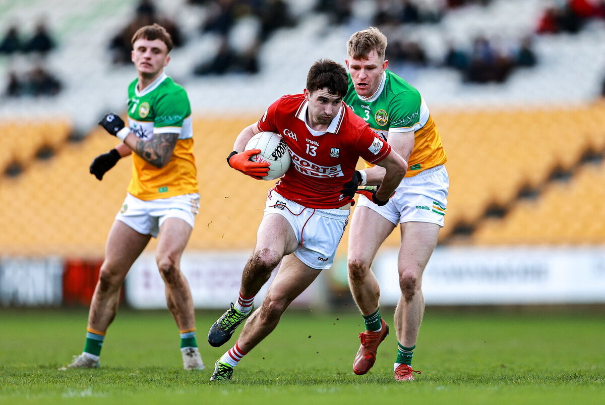 Chris Óg Jones of Cork in action against David Dempsey of Offaly. Picture: Thomas Flinkow/Sportsfile