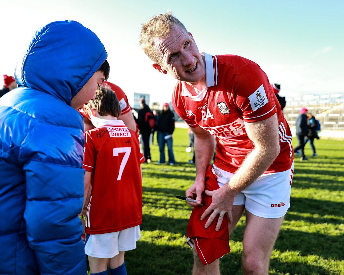 Ruairí Deane of Cork signs a supporter's jersey after the win over Offaly. Picture: Thomas Flinkow/Sportsfile