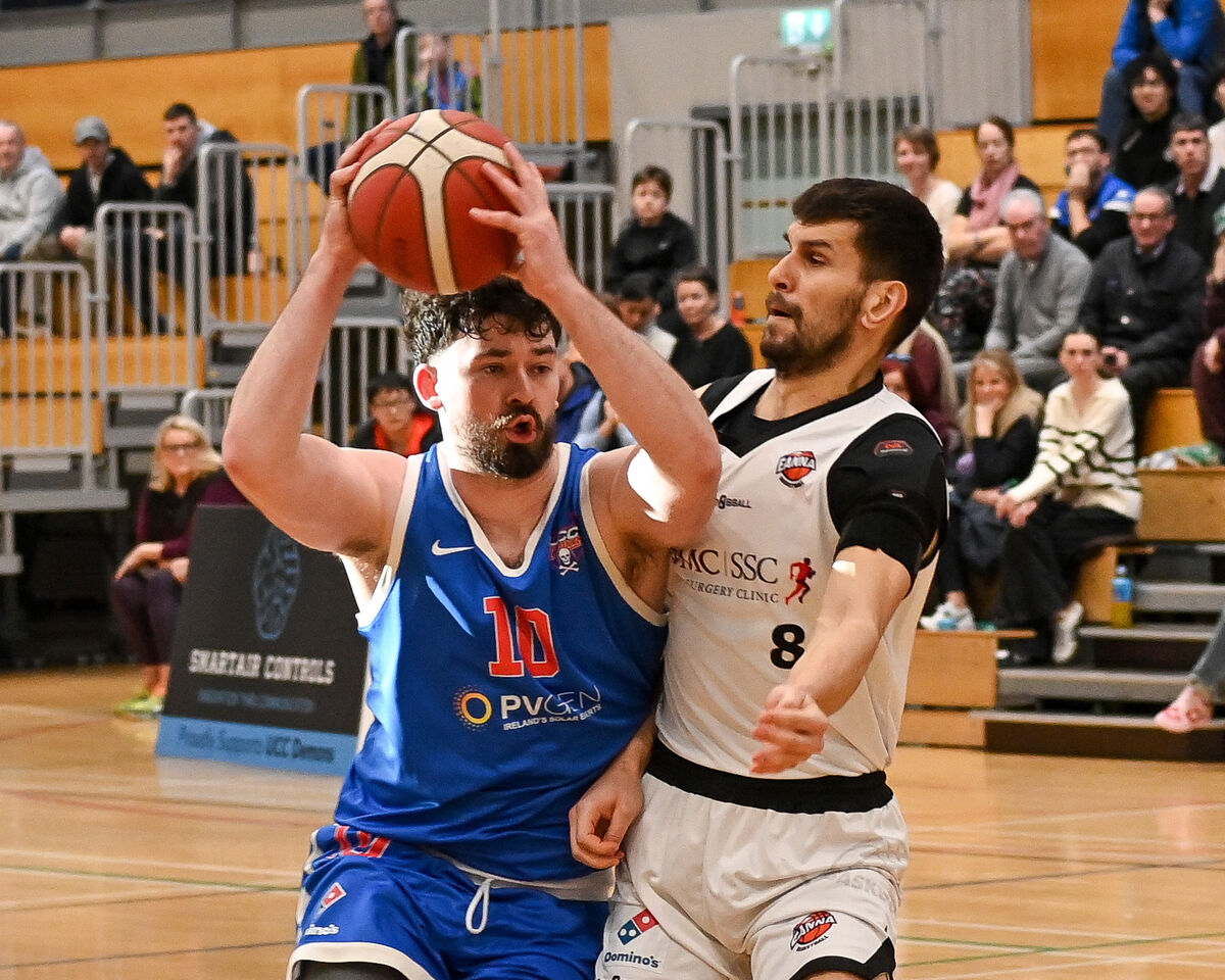UCC Demons' David Lehane keeps possession under pressure from Eanna's Stefan Desnica. Picture: David Keane. UCC Demons' David Lehane keeps possession under pressure from Eanna's Stefan Desnica. Picture: David Keane.