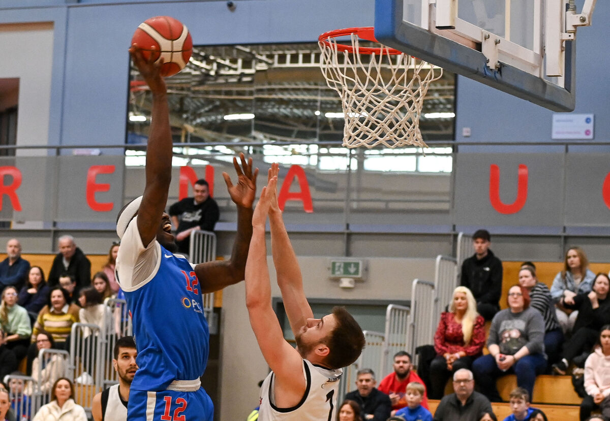  UCC Demons' Tamyrik Fields shoots under pressure from Eanna's Kristijan Andabaka during their Men's Super League clash at the Mardyke Arena. Picture: David Keane.