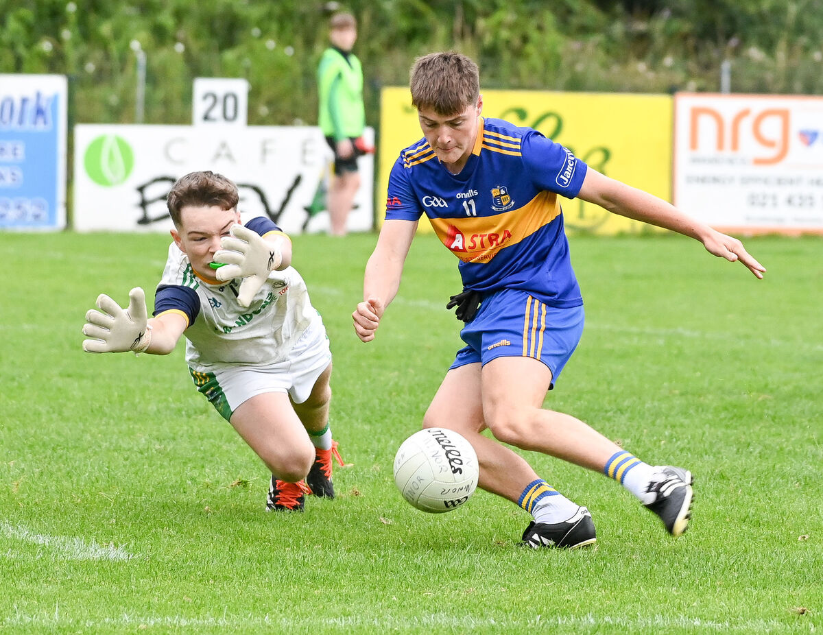  Carrigaline's Eoghan Ahern shoots under pressure from Glanmire's Zach Deane. Picture: David Keane