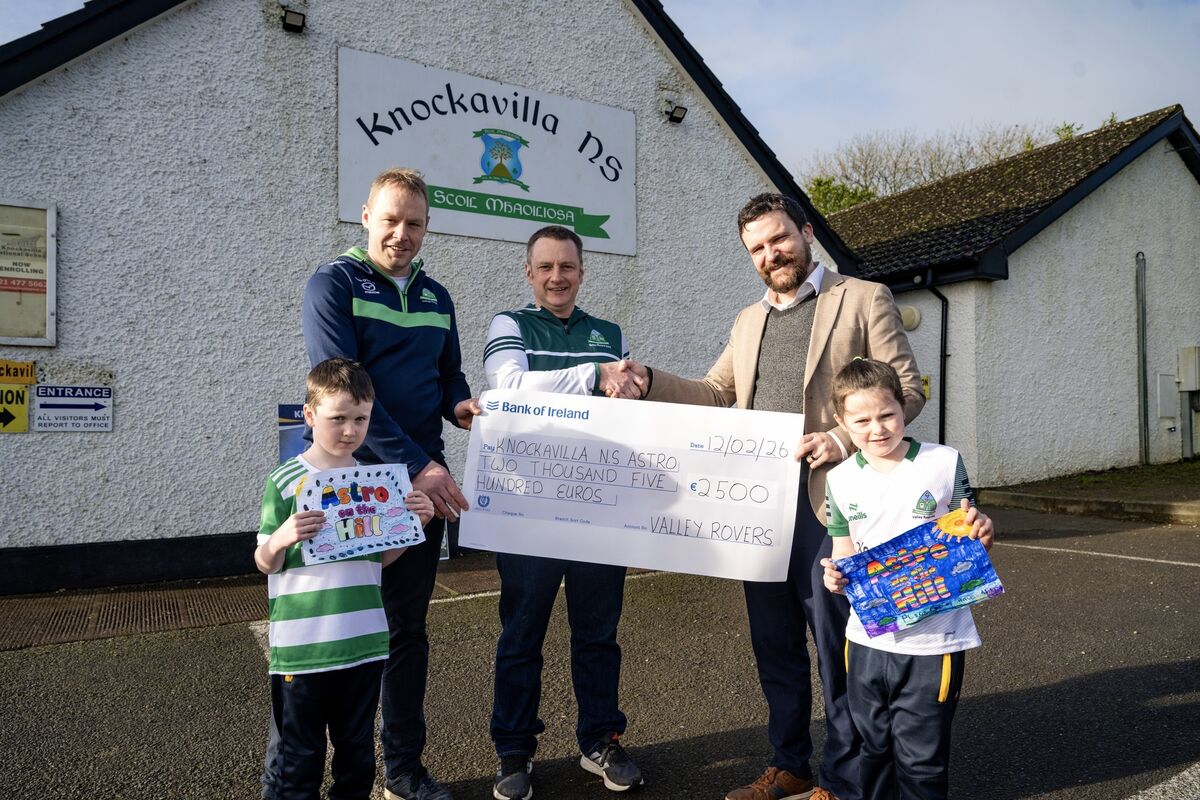 Kevin Canty and John Lynch of Glen Valley Rovers present Knockavilla National School principal Rónan Collins with a cheque for €2,500 to help kick-start the fundraising campaign.