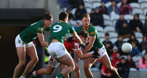 Paul Walsh is tackled by Daithi McGowan, Jack Kinlough and Ronan Jones 9/12/2023