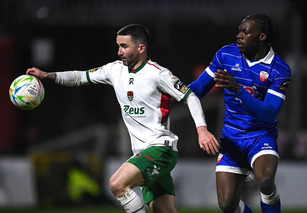 Sean Maguire of Cork City in action against Darren Nwankwo of Treaty United. Picture: Matt Browne/Sportsfile