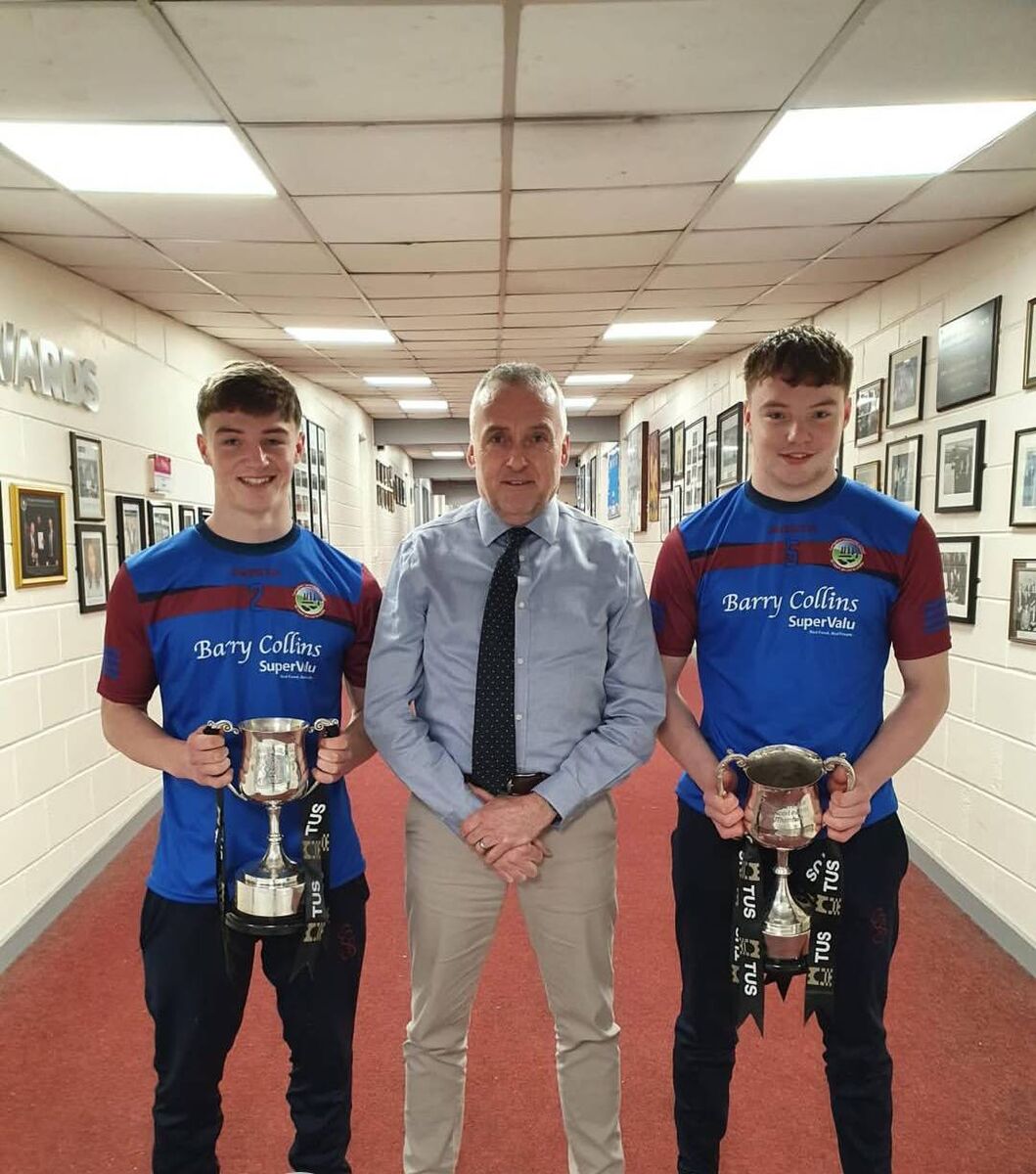 Brothers Donal (U17 captain) and David (U19 captain) Herlihy with principal Paul Burke of Shamrocks GAA.