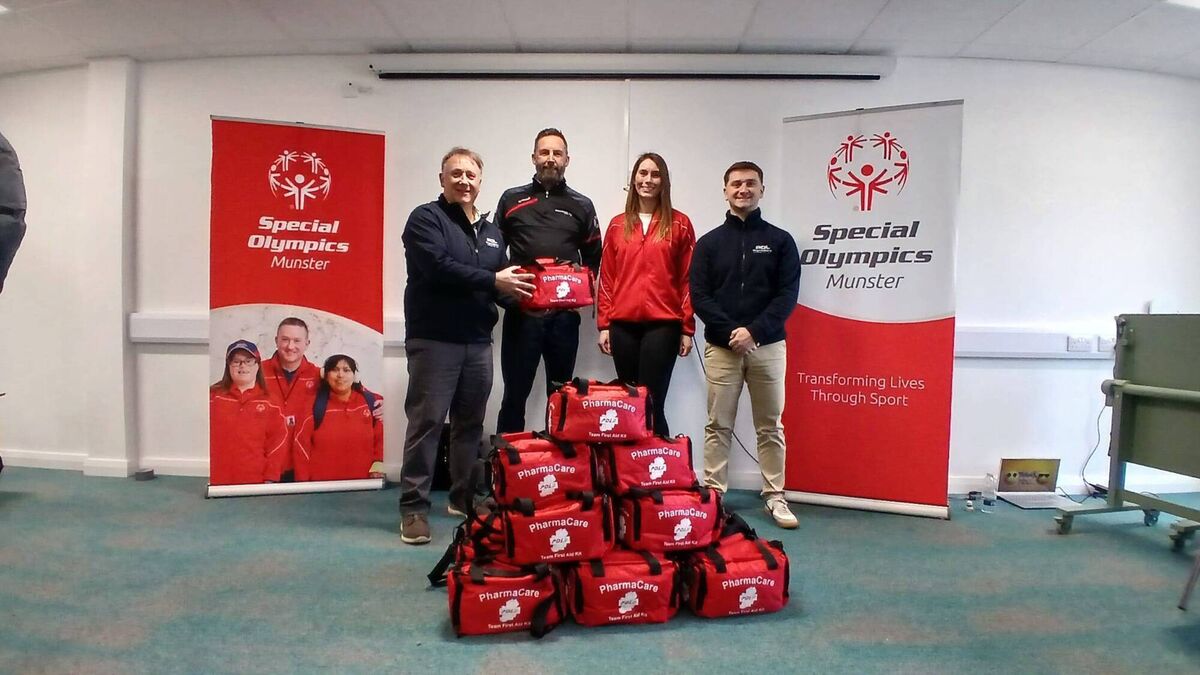 Billy Cotter form PharmaCare makes a presentation of first aid kits to Special Olympics Munster Regional Director Mr Eóin Ó’Béará at the Special Olympics office in Ballincollig recently.