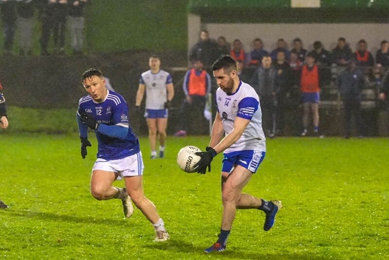 Donncha Ó Ceocháin of Naomh Abán looks to challenge Matthew Dilworth, Knocknagree. Picture: Noel Sweeney